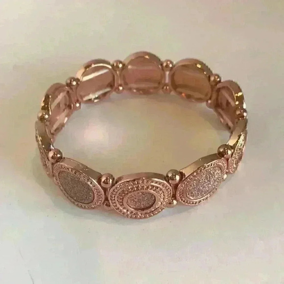 Macy’s new copper colored faux diamond bracelet - Picture 2 of 8